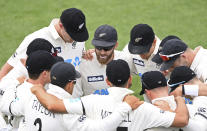 New Zealand's Captain Kane Williamson, center, talks to his players ahead of play against the West Indies on day three of their first cricket test in Hamilton, New Zealand, Saturday, Dec. 5, 2020. (Andrew Cornaga/Photosport via AP)