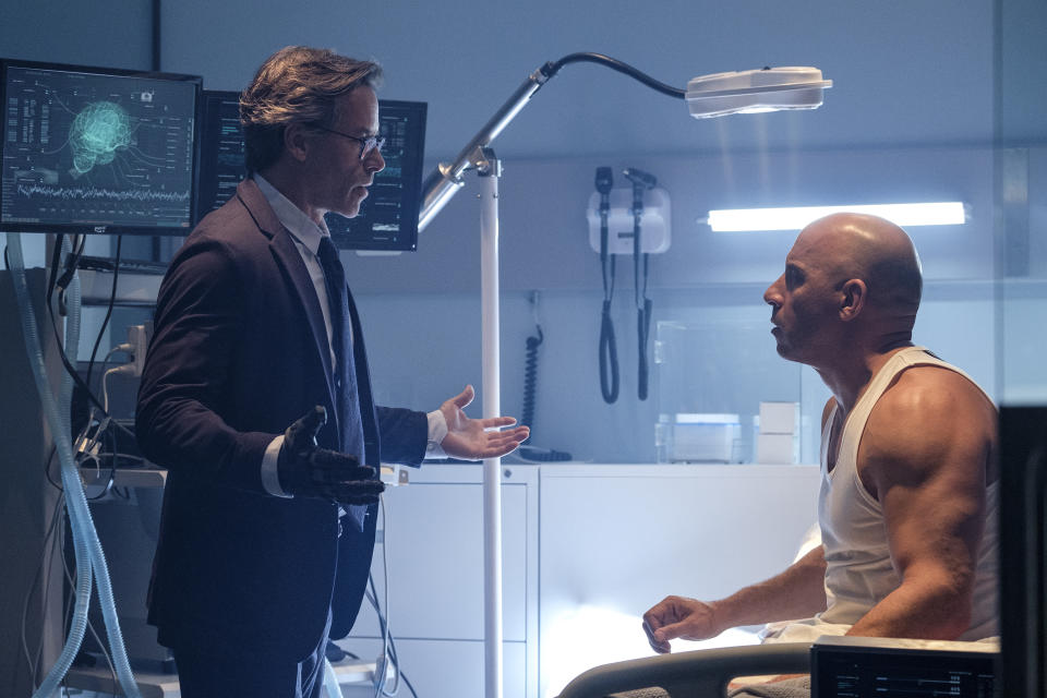 This image released by Columbia Pictures shows Guy Pearce, left, and Vin Diesel in a scene from "Bloodshot." (Graham Bartholomew/Sony/Columbia Pictures via AP)