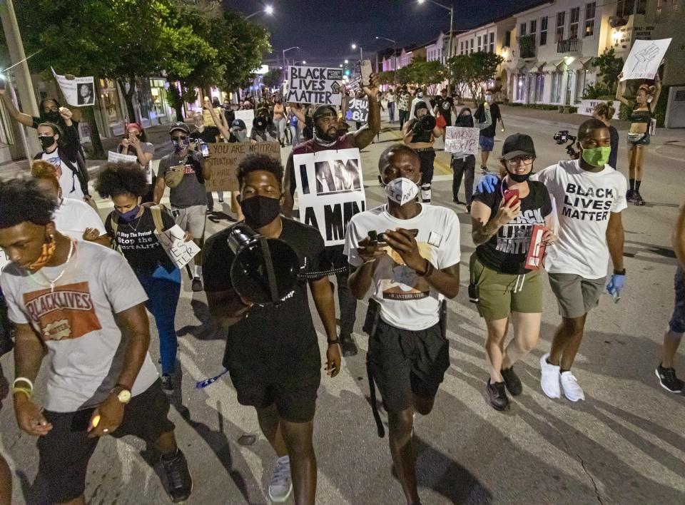 Protesters march along South Dixie Highway during the Declaration Juneteenth Solidarity in West Palm Beach on June 20, 2020. The event was described as a demonstration against systemic racism and affronts to the black community, as well as a recognition of the day when slavery was outlawed nationally.