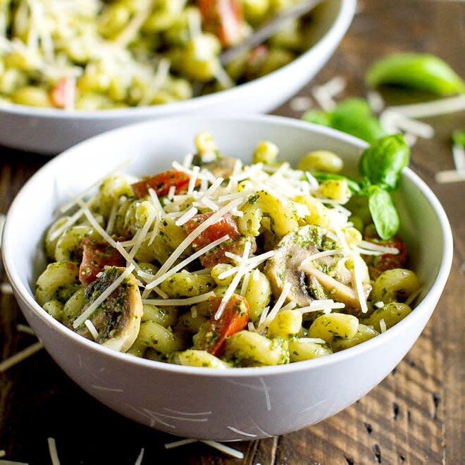 Pesto Cavatappi is a delicious, easy recipe perfect for busy weeknights! Start with chewy pasta and toss it with a homemade pesto cream sauce, tomatoes, and mushrooms. It's even better than the Noodles & Company version!