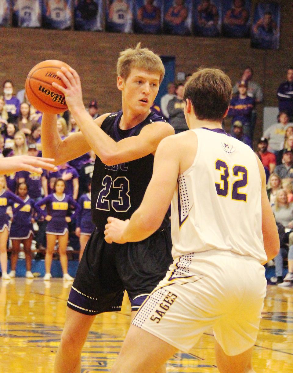 Jake Funk of El Paso-Gridley looks to pass the ball as Monticello's Joey Sprinkle defends Friday.