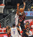 Toronto Raptors' Chris Boucher (25) shoots under pressure from Oklahoma City Thunder's Darius Bazley (7) and Moses Brow, center, during the first quarter of a basketball game Sunday, April 18, 2021, in St. Petersburg, Fla. (AP Photo/Steve Nesius)