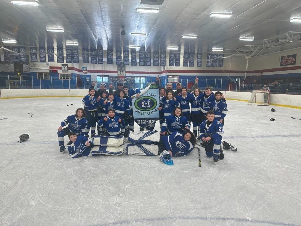 Members of the SWS U12 'B' co-ed ice hockey team after blanking Martha's Vineyard in the league championship game.