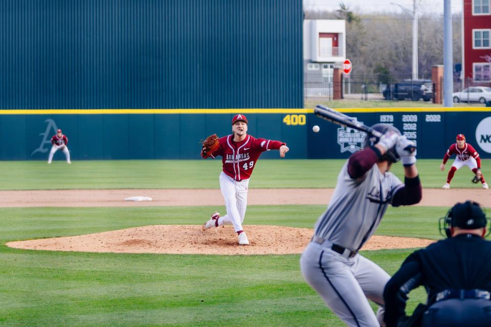 Arkansas baseball' Stone Hewlett fires a pitch during the Razorbacks' 11-0 win over Little Rock Tuesday, March 26, 2024.