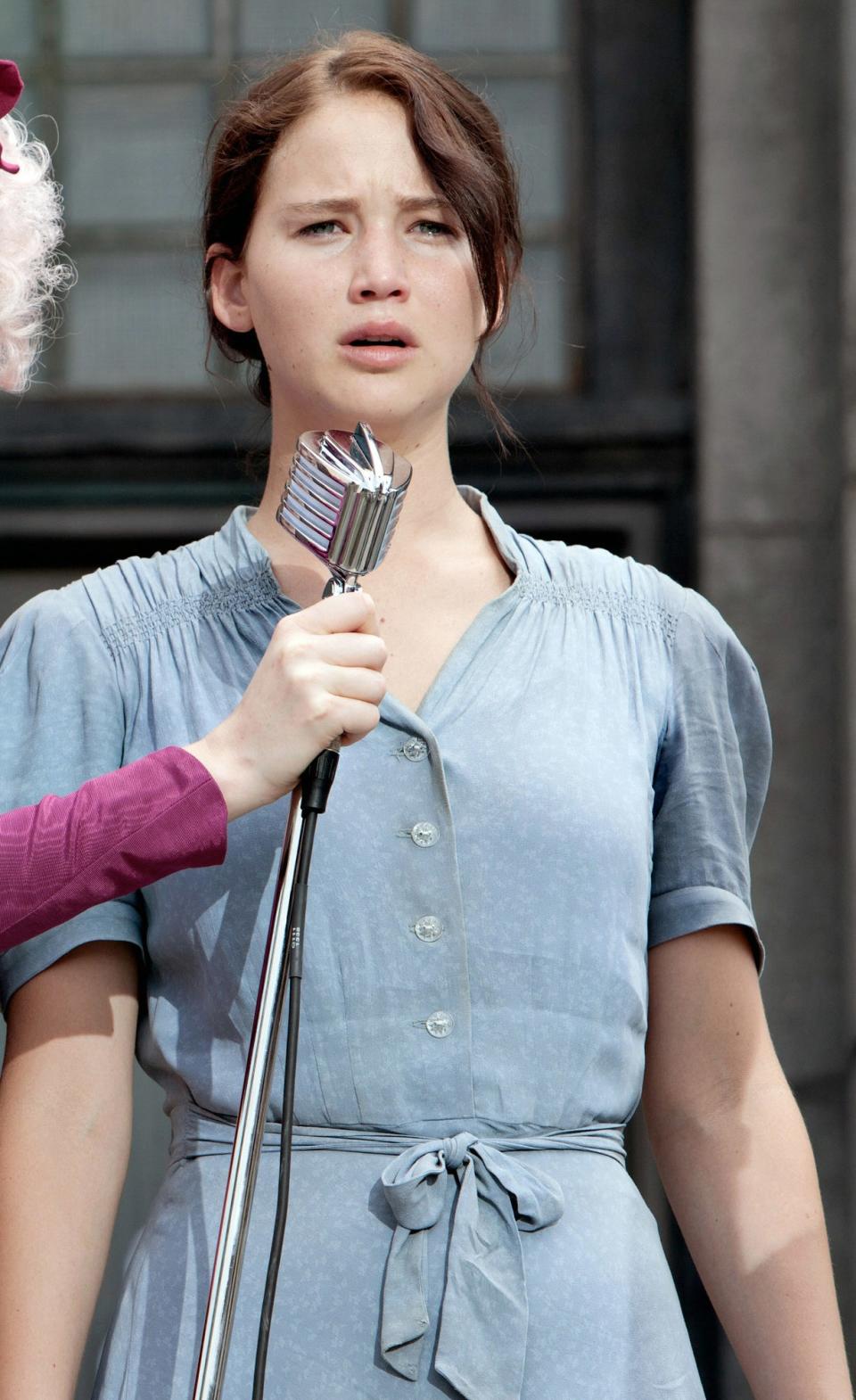 Katniss in a simple blue dress