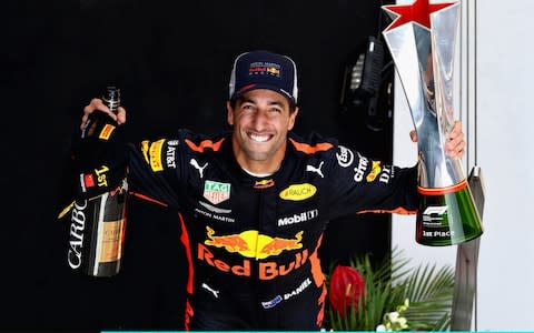 Race winner Daniel Ricciardo of Australia and Red Bull Racing celebrates on the podium during the Formula One Grand Prix of China at Shanghai International Circuit on April 15, 2018 in Shanghai, Chin - Credit: Getty Images