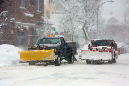 Snowplows are seen in the street during a winter storm in Buffalo, New York, U.S., January 31, 2019. REUTERS/Lindsay DeDario