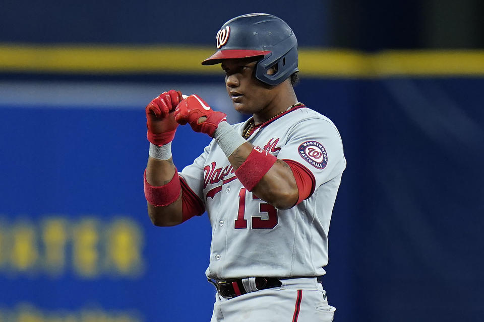 Washington Nationals' Starlin Castro (13) reacts after his RBI double off Tampa Bay Rays relief pitcher Diego Castillo during the 11th inning of a baseball game Wednesday, June 9, 2021, in St. Petersburg, Fla. (AP Photo/Chris O'Meara)