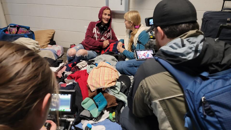 Hope Campus participant Kynna McChesney on the left and director/writer Julia Verdin on the right sit in the background as the Robert Craig Films camera crew works in the foreground.