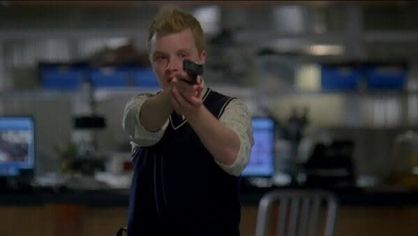 Stuckey pointing a gun at Stabler and Warner