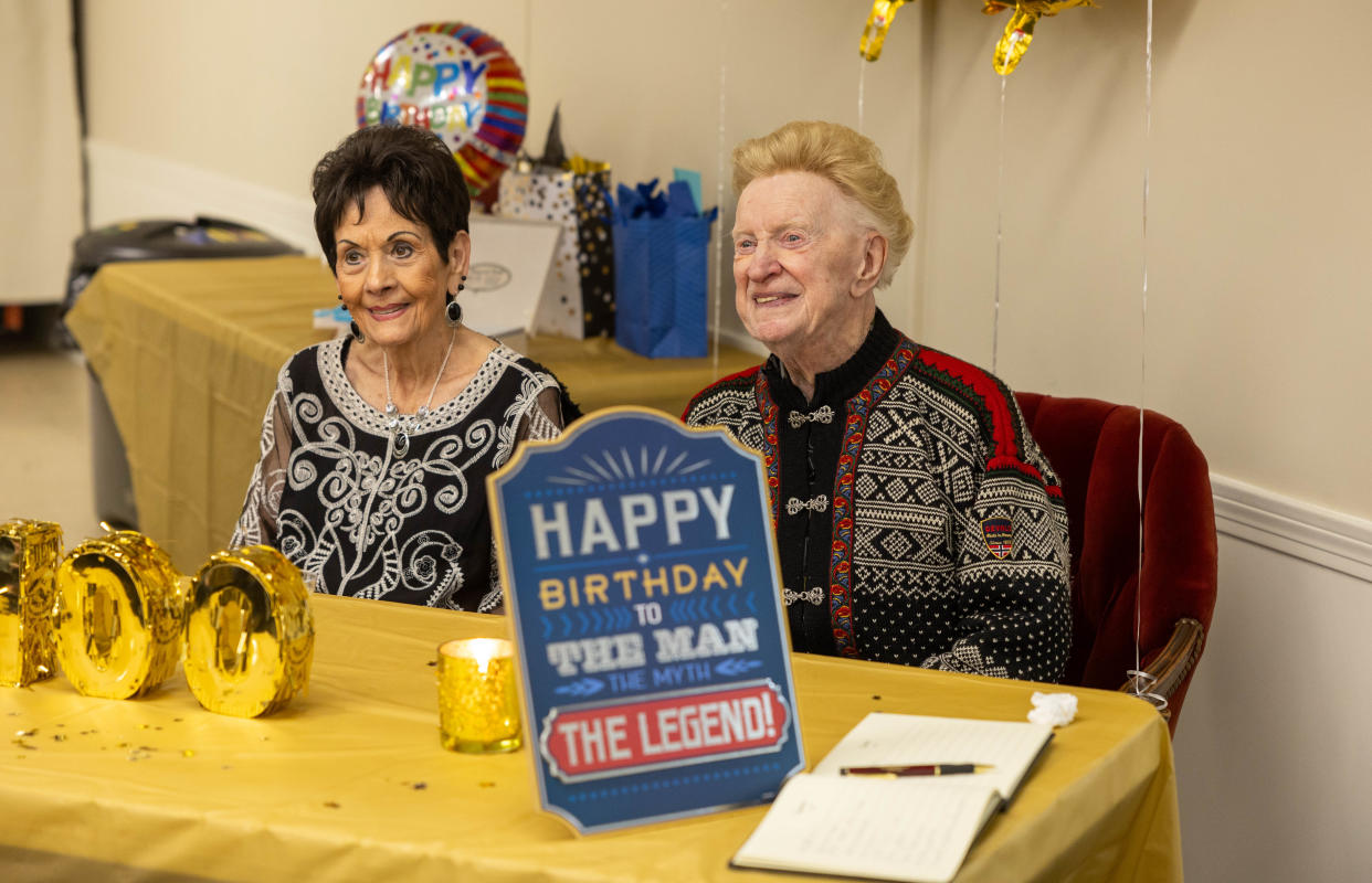 Ravenna resident Vernon Roen, right, and his wife, Katy, sit and listen to family and friends speak Saturday, Feb. 10, 2024, at an event held to celebrate the World War II veteran’s 100th birthday at the Ravenna VFW.