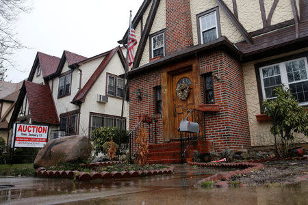 FILE PHOTO: A childhood home of U.S. President-elect Donald Trump is seen with an auction sign in the Queens borough of New York, U.S., January 17, 2017. REUTERS/Shannon Stapleton/File Photo