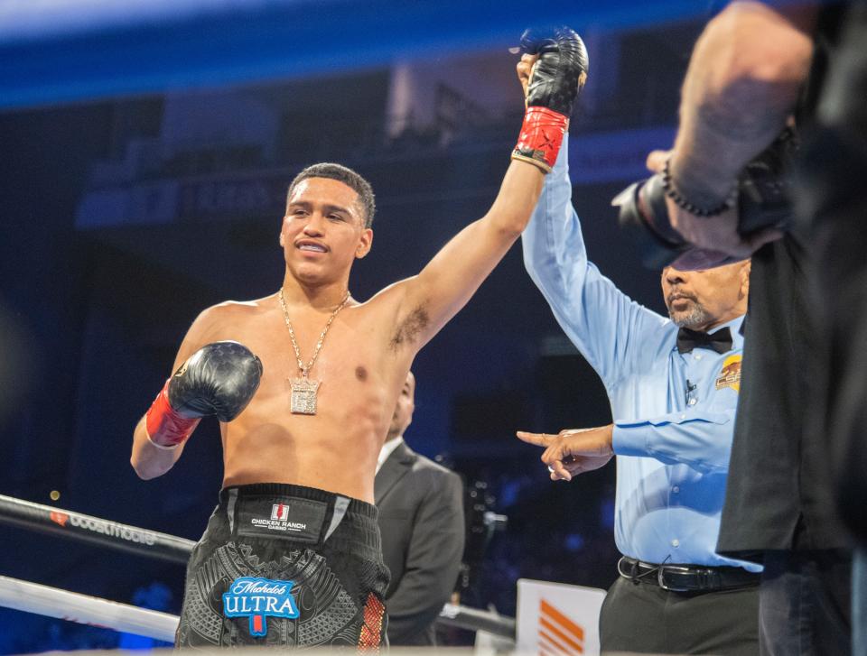 Stockton Gabriel Flores Jr., is declared the winner after knocking out Derrick Murray in a lightweight undercard bout at the Stockton Arena in downtown Stockton on Saturday, May 13, 2023. Flores won the fight with a first round knockout. Also on the card were the WBO bantamweight championship between Vincent Astrolabio and Jason Maloney and the WBO middleweight championship between Steve Butler and Janibeck Alimkhanuly.