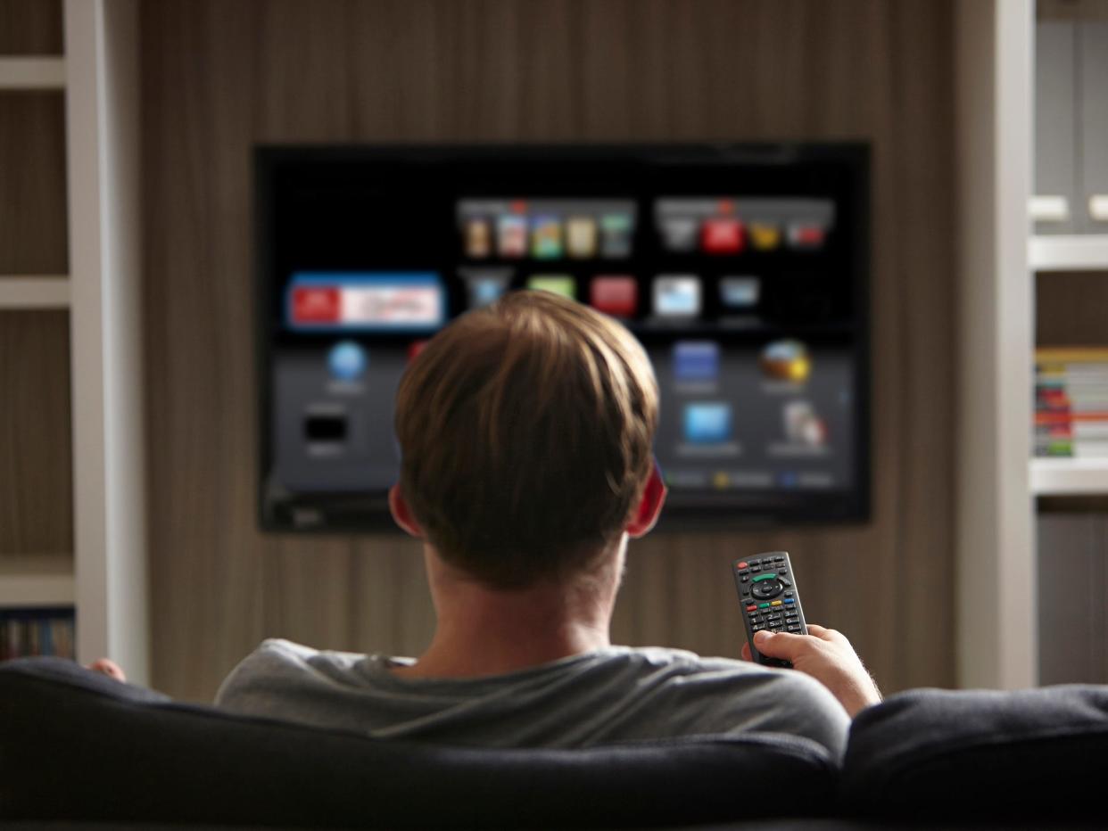 Man sitting in front of smart TV