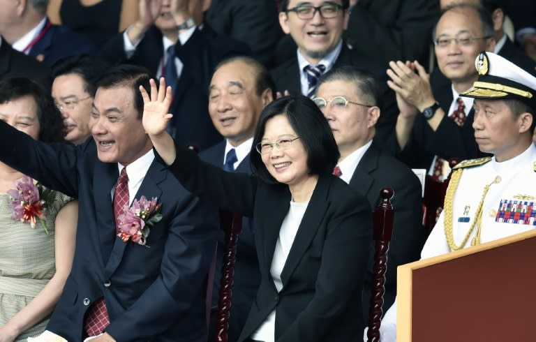 Taiwan's President Tsai Ing-wen (C) waves during National Day celebrations, in front of the Presidential Palace in Taipei, on October 10, 2016