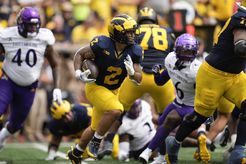 Michigan running back Blake Corum (2) runs against East Carolina in the second half of an NCAA college football game in Ann Arbor, Mich., Saturday, Sept. 2, 2023. (AP Photo/Paul Sancya)