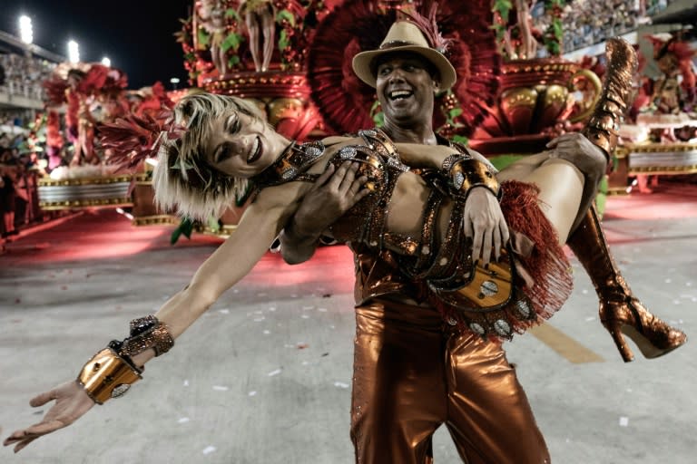 Dancers with the Grande Rio samba school perform during the carnival parade at the Sambadrome in Rio de Janeiro, on February 8, 2015