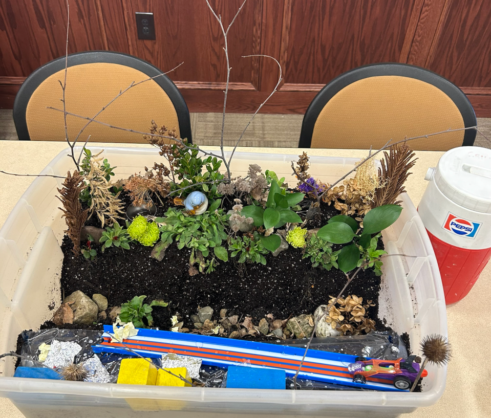 Maggie Reilly, climate adaptation specialist at Ramboll engineering, made a diorama to help educate local youth on soil health and floodplain adaptation.