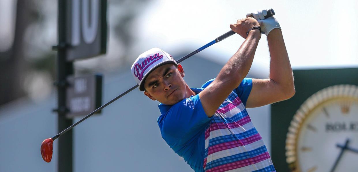 Rickie Fowler watches his tee shot at the 10th hole go down the fairway during the final round of the 2015 Players Championship. Fowler played eight holes of regulation and a playoff at 7-under to win.