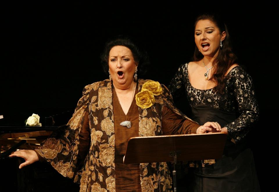 FILE - In this Nov. 17, 2006, file photo, Spanish soprano Montserrat Caballe, left, performs with her daughter Montserrat Marti, right, on the occasion of the celebration of her 50th stage anniversary in Basel, Switzerland. Montserrat Caballe, a Spanish opera singer renowned for her bel canto technique and her interpretations of the roles of Rossini, Bellini and Donizetti, has died. She was 85. Hospital Sant Pau spokesman Abraham del Moral confirmed her death early Saturday, Oct. 6, 2018, to The Associated Press.(Georgios Kefalas/Keystone via AP, File)