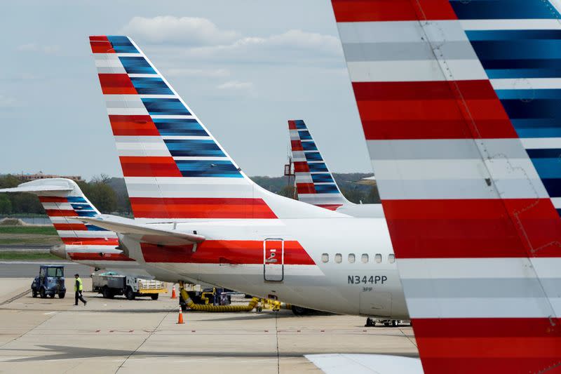 FILE PHOTO: FILE PHOTO: American Airlines planes are parked at the gate during the coronavirus disease (COVID-19) outbreak in Washington