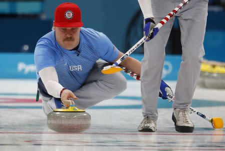 Curling - Pyeongchang 2018 Winter Olympics - Men's Round Robin - Britain v U.S. - Gangneung Curling Center - Gangneung, South Korea - February 21, 2018 - Matt Hamilton of the U.S. delivers a stone. REUTERS/Phil Noble