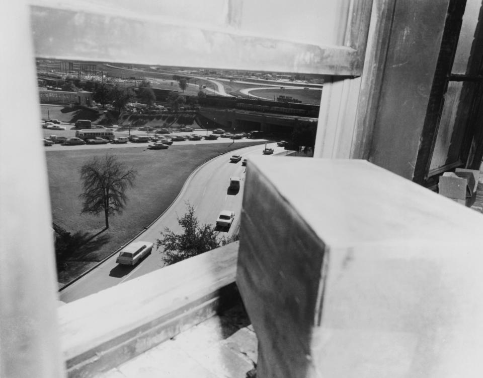 The view from the sixth floor window of the Texas School Book Depository in Dallas, from which Lee Harvey Oswald is thought to have assassinated President John F. Kennedy, Nov. 22, 1963. This photograph was taken approximately one hour after the assassination. (Photo: Hulton Archive/Getty Images)