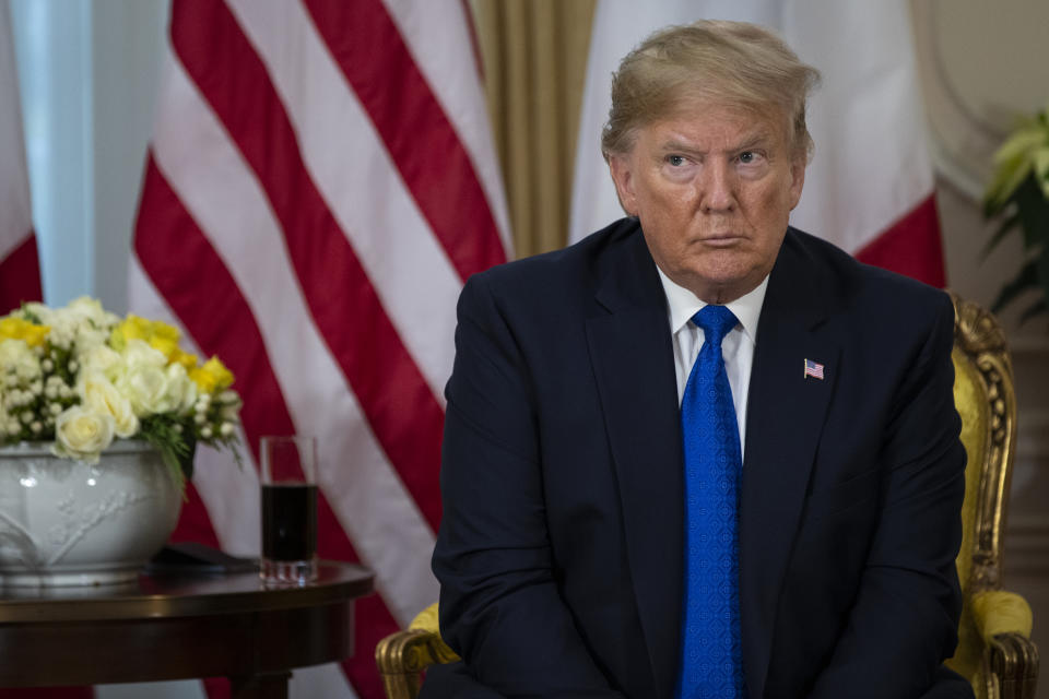 President Donald Trump listens as French President Emmanuel Macron speaks during a meeting at Winfield House during the NATO summit, Tuesday, Dec. 3, 2019, in London. (AP Photo/ Evan Vucci)