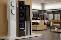 A sales assistant of Samsung Electronics works at its store in Seoul