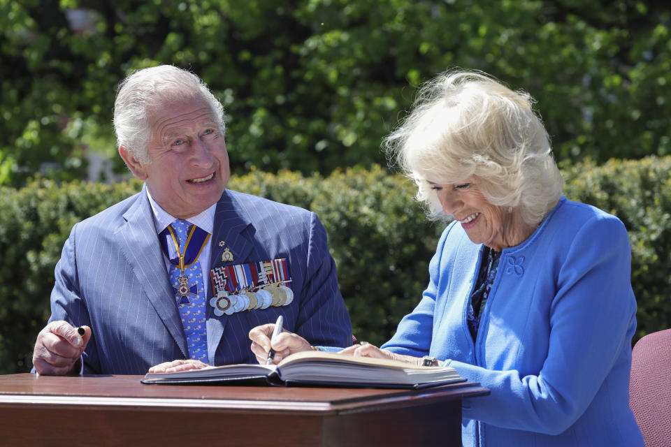 OTTAWA, CANADA - MAY 18: Prince Charles, Prince of Wales and Camilla, Duchess of Cornwall sign the Veteran Affairs Canada Visitor’s Book before departure on day two of their Platinum Jubilee Royal Tour of Canada on May 18, 2022 in Ottawa, Canada. The Prince of Wales and Duchess of Cornwall are visiting for three days from 17th to 19th May 2022. The tour forms part of Queen Elizabeth II's Platinum Jubilee celebrations. (Photo by Chris Jackson/Getty Images)