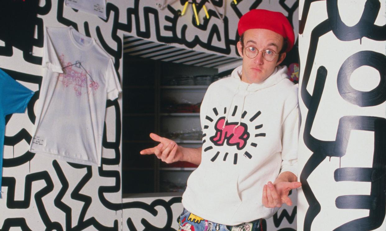 <span>Keith Haring in a Radiant Baby sweatshirt at the opening of his Pop Shop in 1986.</span><span>Photograph: Nick Elgar/Corbis/VCG/Getty Images</span>