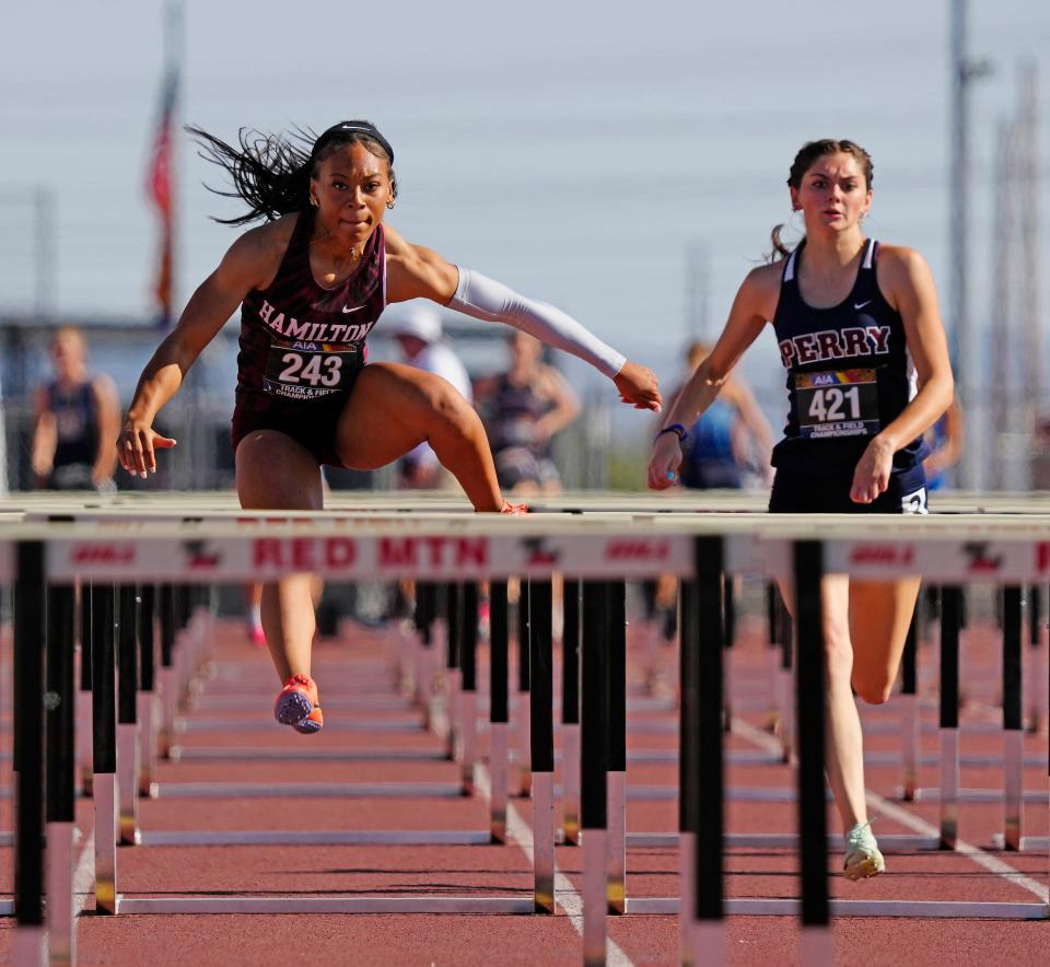 Hamilton's Kori Martin (243) wins the 100-meter hurdles during the track and field championships at Red Mountain High School in Mesa on May 6, 2023.