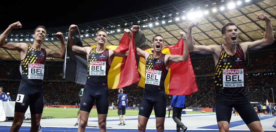 From left, Belgium's Jonathan Sacoor, Dylan Borlee, Kevin Borlee and Jonathan Borlee celebrate winning the men's 4 x 400 meter final race for the team of Belgium at the European Athletics Championships in Berlin, Germany, Saturday, Aug. 11, 2018. (AP Photo/Michael Sohn)