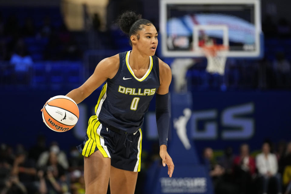 Dallas Wings forward Satou Sabally brings the ball up during a game against the Phoenix Mercury on June 7, 2023, in Arlington, Texas. Satou and sister Nyara Sabally will play against each other for the first time ever when Dallas visits New York on Sunday. (AP Photo/Tony Gutierrez)