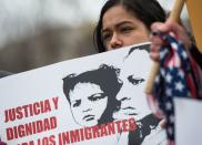 <p>A young girl looks on as other immigrants and activists protest near the White House to demand that the Department of Homeland Security extend Temporary Protected Status (TPS) for more than 195,000 Salvadorans on Jan. 8, 2018 in Washington. (Photo: Andrew Caballero-Reynolds/AFP/Getty Images) </p>