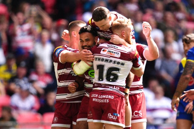 Bevan French (left, facing) celebrates scoring his side’s second try of the game 