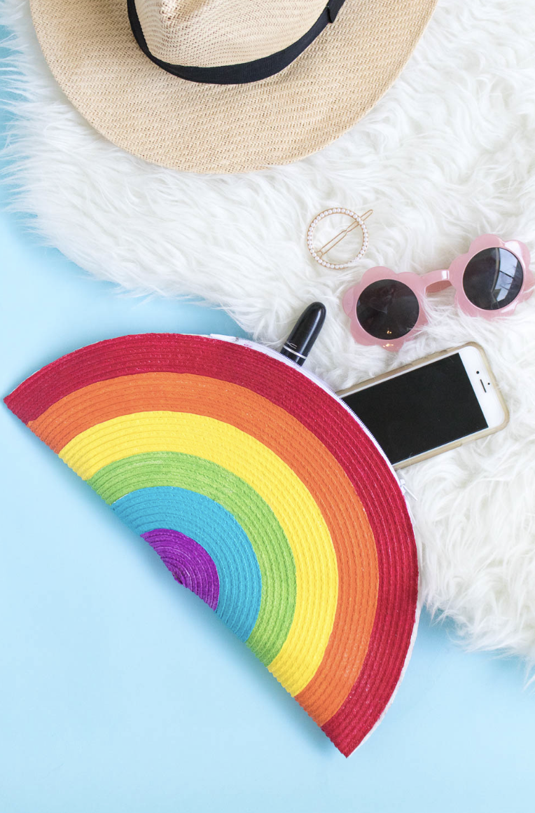 crafts for kids, rainbow designed clutch with a phone, glasses, lipstick and hair accessory