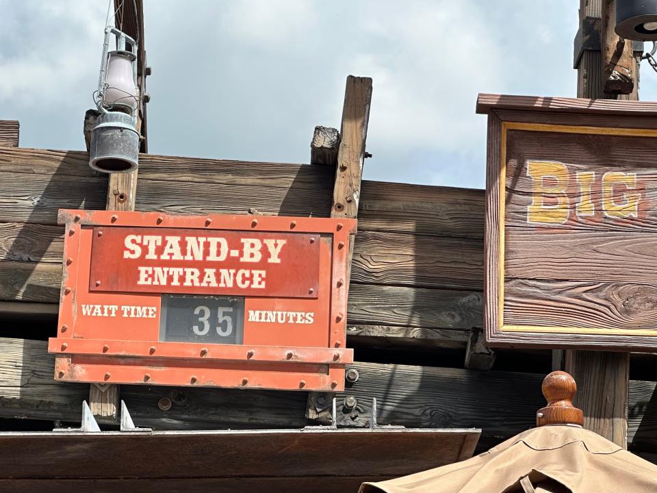 stand-by wait time sign in front of big thunder mountain railroad in disney world
