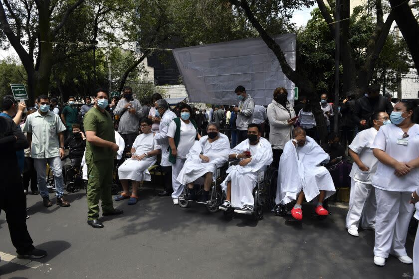 Patients remain outside a hospital after an earthquake in Mexico City on September 19, 2022. - A 6.8-magnitude earthquake struck western Mexico on Monday, shaking buildings in Mexico City on the anniversary of two major tremors in 1985 and 2017, seismologists said. (Photo by CLAUDIO CRUZ / AFP) (Photo by CLAUDIO CRUZ/AFP via Getty Images)