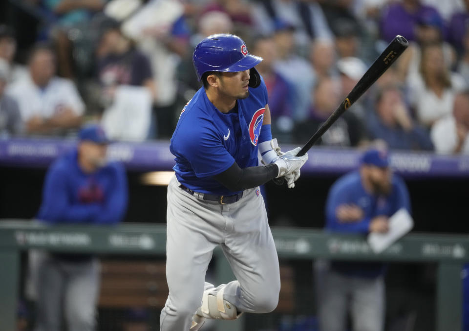 Chicago Cubs' Seiya Suzuki watches his RBI single off Colorado Rockies starting pitcher Chris Flexen during the second inning of a baseball game Tuesday, Sept. 12, 2023, in Denver. (AP Photo/David Zalubowski)