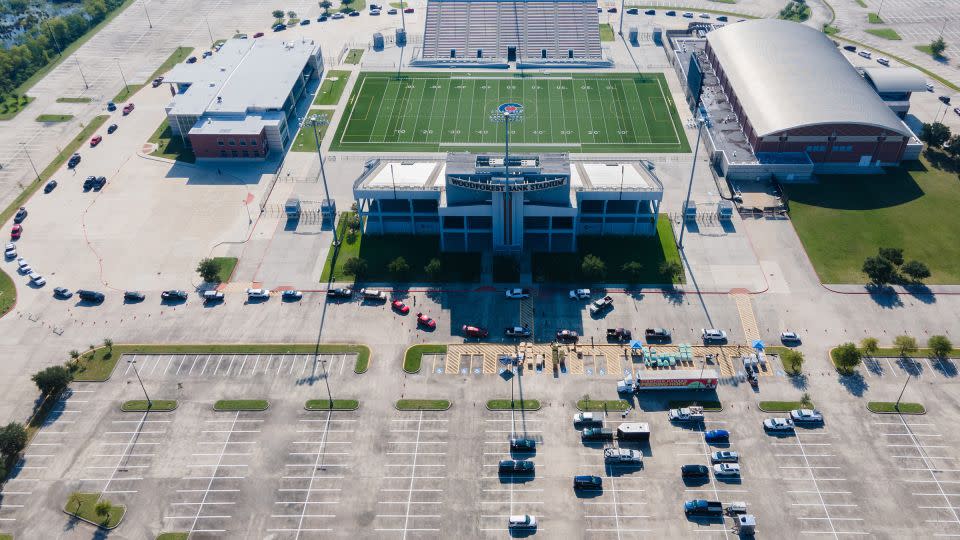 Cars line up for supply distribution at Woodforest Bank Stadium in Shenandoah, Texas, on Wednesday. - Jason Fochtman/Houston Chronicle/Getty Images