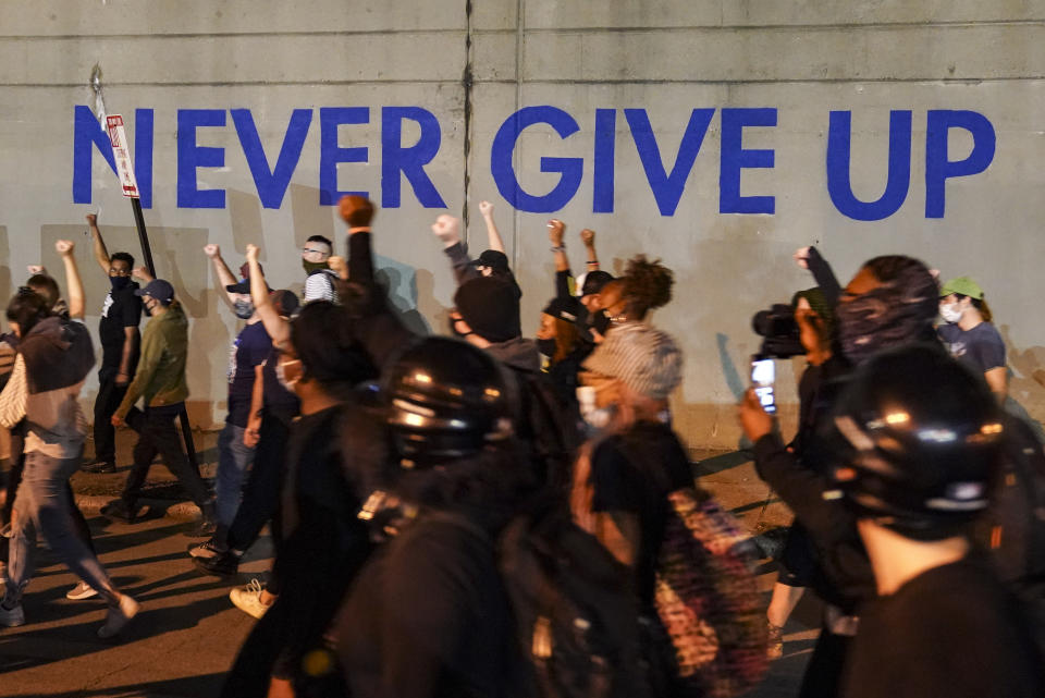 FILE - In this Sept. 24, 2020, file photo, protesters march in Louisville, Ky. Hours of material in the grand jury proceedings for Taylor’s fatal shooting by police have been made public on Friday, Oct. 2. (AP Photo/John Minchillo, File)