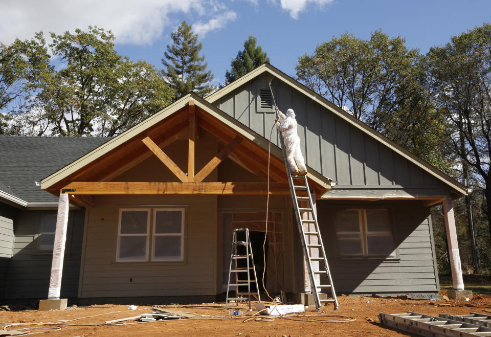 In this photo taken Thursday, Oct. 17, 2019, a home under construction is painted in Paradise, Calif. Only a handful of homes have been rebuilt in the community that lost nearly 9,000 residences in last year's Camp Fire. (AP Photo/Rich Pedroncelli)