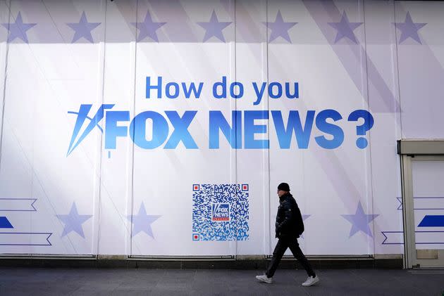 A person walks past the Fox News Headquarters at the News Corporation building in New York City on March 9. Dominion Voting Systems is suing Fox News and parent company Fox Corp. over election fraud claims.