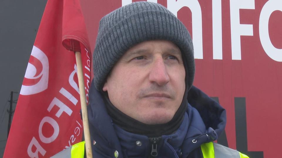 Dan Cipparone, a Unifor Local 195 who works in inventory control at Jamieson Laboratories stands on the picket line.