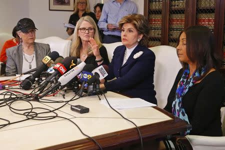 Three women who allege they were sexually assaulted by comedian Bill Cosby, Linda Kirkpatrick (2nd L) and two unidentified women, sit with lawyer Gloria Allred (2nd R) at a news conference in Los Angeles, California, January 7, 2015. REUTERS/Lucy Nicholson