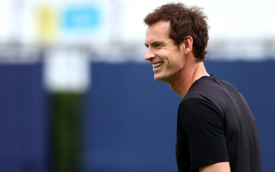 Andy Murray smiles during practice ahead of competing in the doubles competition at Queen's Club - Getty Images Europe