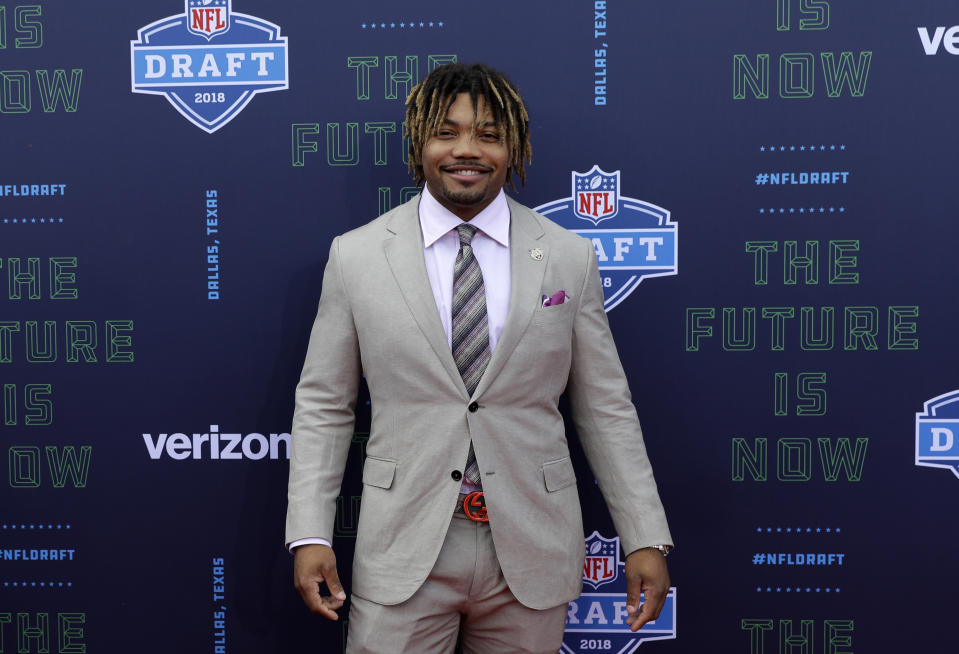 <p>LSU’s Derrius Guice poses for photos on the red carpet during the first round of the 2018 NFL football draft, Thursday, April 26, 2018, in Arlington, Texas. (AP Photo/Eric Gay) </p>