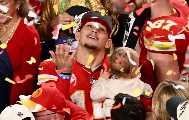 <p>PATRICK T. FALLON/AFP via Getty </p> Kansas City Chiefs' quarterback #15 Patrick Mahomes with his son Patrick Bronze watches confettis as they celebrate winning Super Bowl LVIII against the San Francisco 49ers at Allegiant Stadium in Las Vegas, Nevada, February 11, 2024.