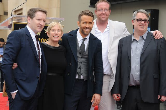 <p>Frank Trapper/Corbis via Getty</p> Terry Reynolds (left) and Ryan Reynolds (center) with their mother Tammy and brothers Jeff and Patrick on Dec. 15, 2016